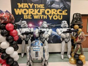 storm troopers in front of workforce poster